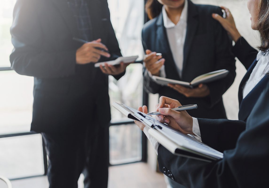 group-of-business-people-stand-together-to-discuss